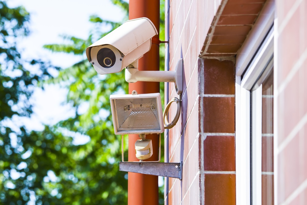 security camera near the outdoor light