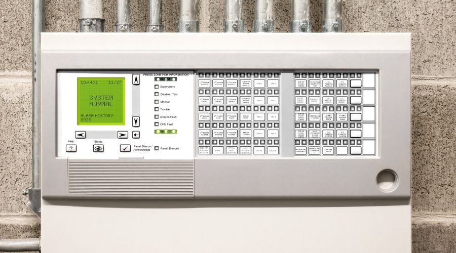 Control panel of single-stage fire alarm system in electrical room of residential or commercial building