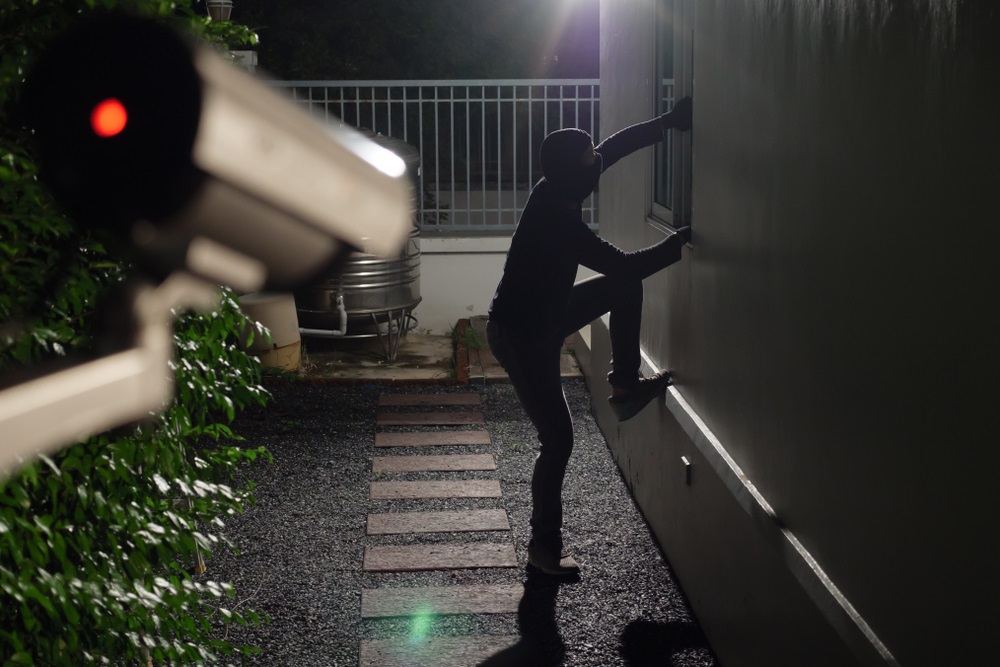 Surveillance camera during sneak into a house at night