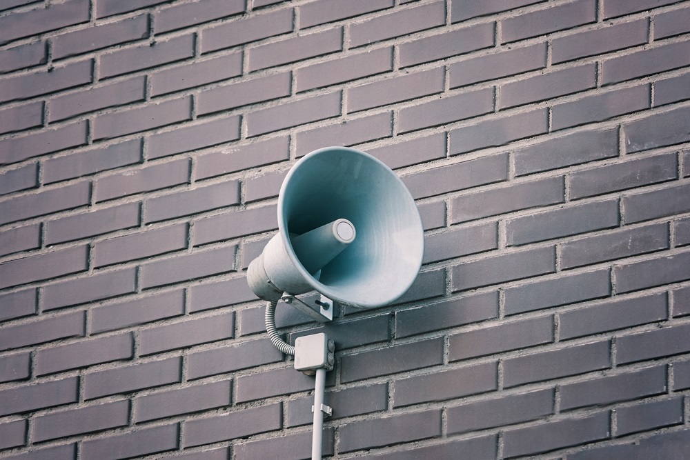 Loud speaker on brick wall